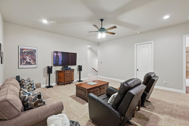 living room with recessed lighting, baseboards, light colored carpet, and a ceiling fan