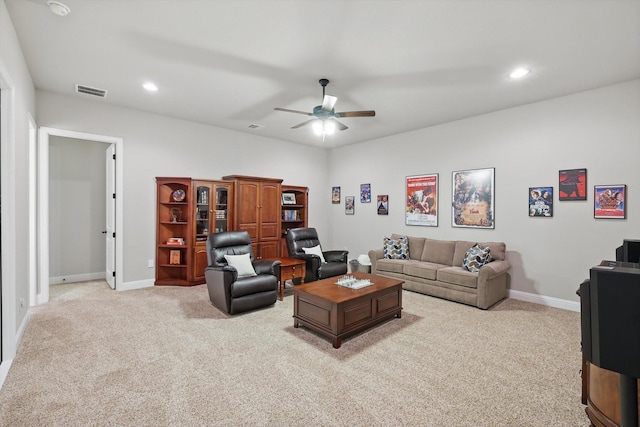 living room featuring light carpet, visible vents, recessed lighting, and baseboards