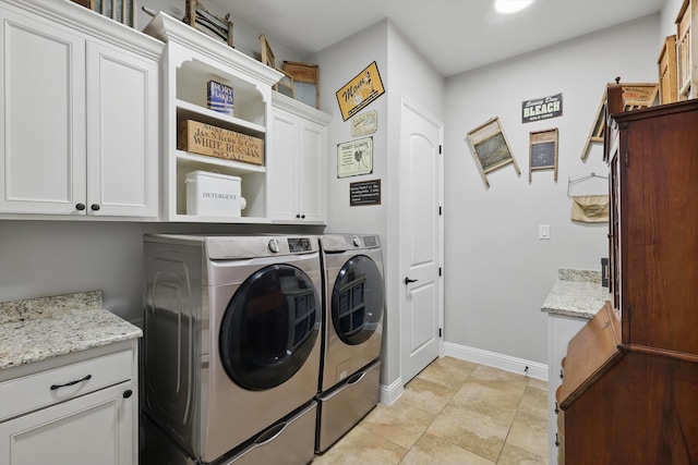 laundry room featuring baseboards, cabinet space, independent washer and dryer, and light tile patterned flooring