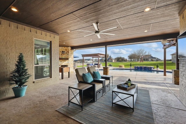 view of patio / terrace with an outdoor pool, outdoor lounge area, and ceiling fan