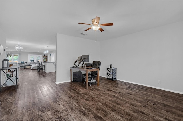 home office featuring visible vents, baseboards, wood finished floors, and ceiling fan with notable chandelier