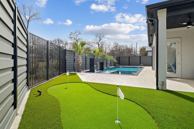 view of yard with a patio area, a fenced in pool, and a fenced backyard