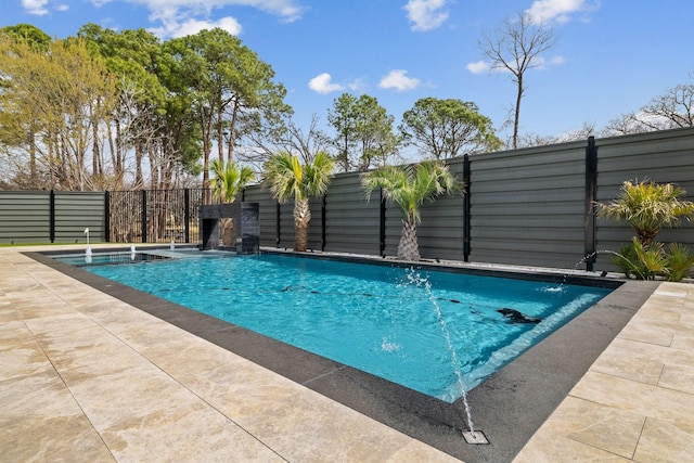 view of swimming pool featuring a fenced in pool, a patio, and fence