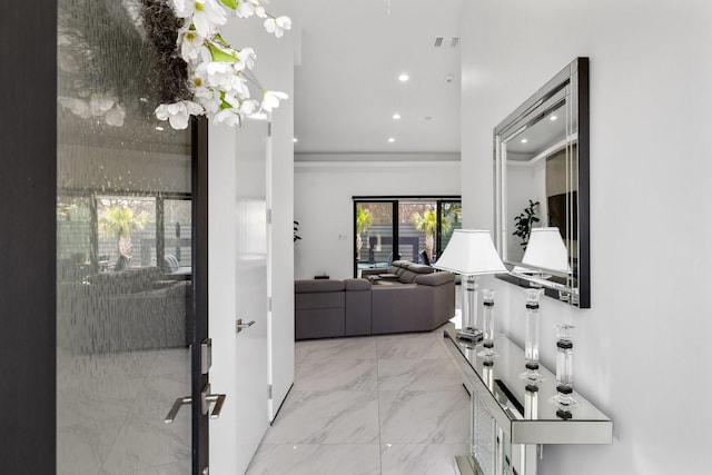 hallway featuring recessed lighting, visible vents, and marble finish floor