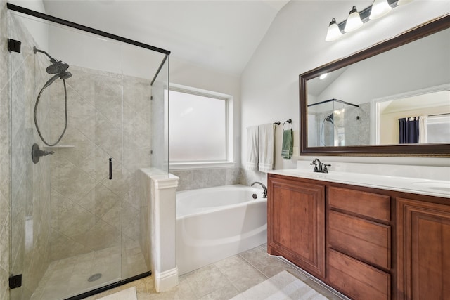 bathroom featuring a stall shower, lofted ceiling, and a bath