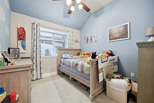 bedroom featuring baseboards, lofted ceiling, light colored carpet, and a ceiling fan