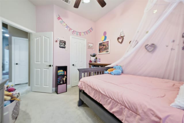 bedroom with light carpet, baseboards, and ceiling fan