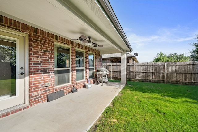 view of patio / terrace featuring grilling area, ceiling fan, and fence