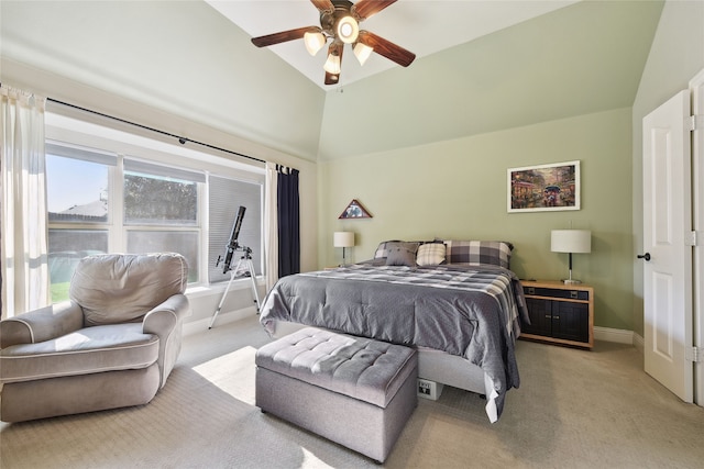 bedroom featuring light colored carpet, a ceiling fan, baseboards, and vaulted ceiling