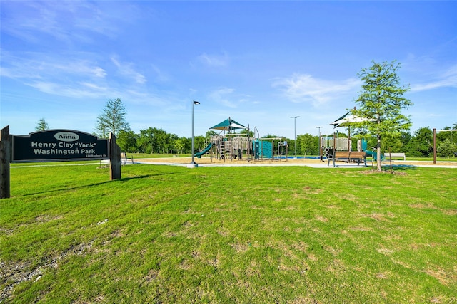 community jungle gym featuring a yard