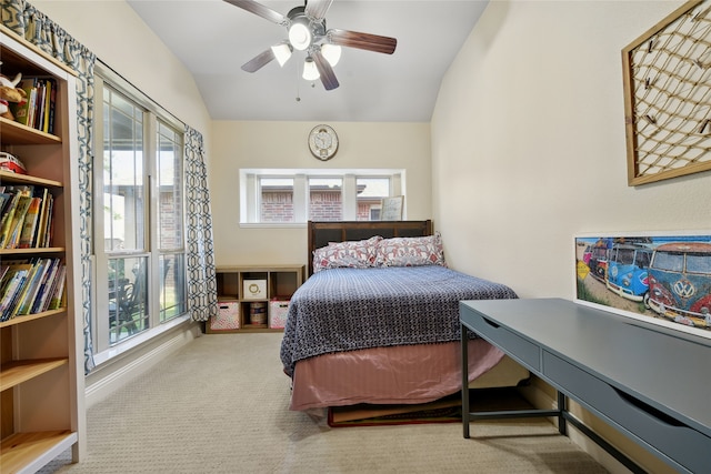 bedroom featuring ceiling fan, baseboards, carpet, and vaulted ceiling