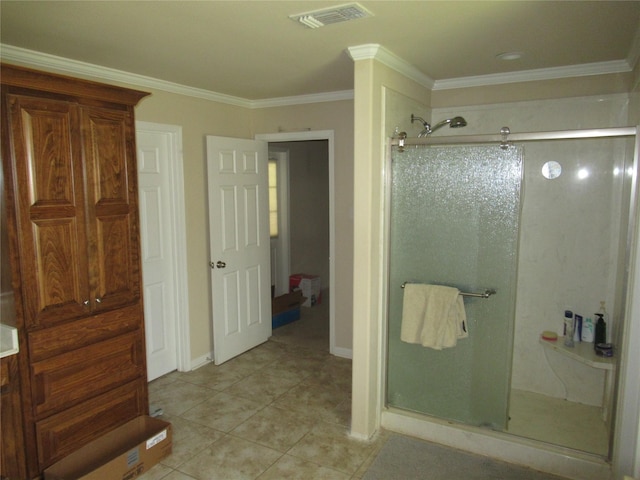 full bathroom featuring tile patterned floors, visible vents, a shower stall, and crown molding