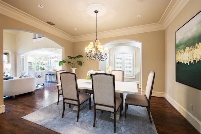 dining space featuring a chandelier, visible vents, a healthy amount of sunlight, and dark wood-type flooring