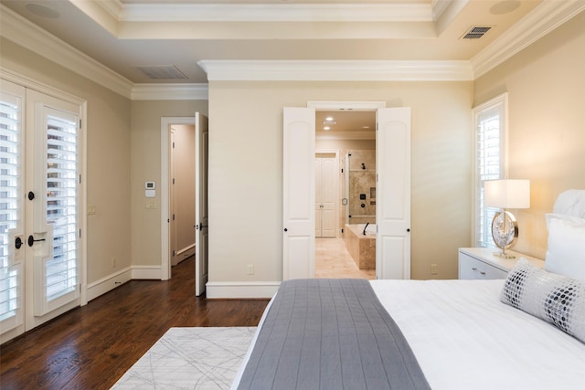 bedroom with visible vents, wood finished floors, french doors, crown molding, and baseboards