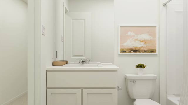 bathroom featuring toilet and vanity