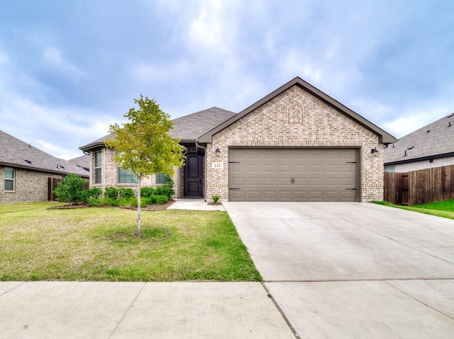 view of front facade featuring brick siding, an attached garage, concrete driveway, and a front lawn