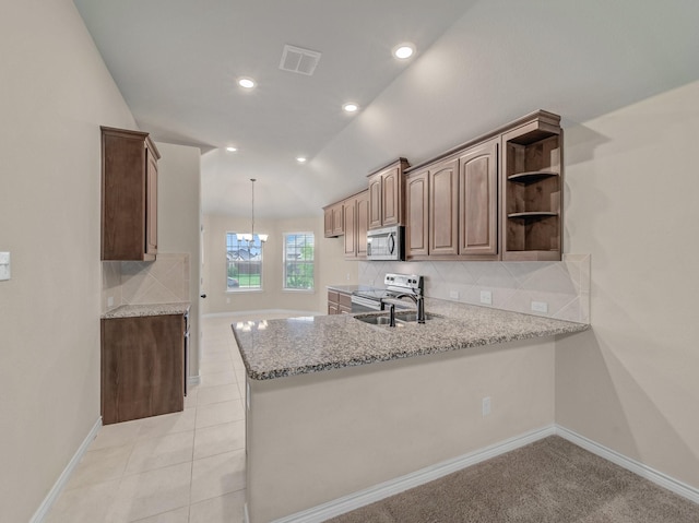 kitchen featuring visible vents, open shelves, tasteful backsplash, appliances with stainless steel finishes, and vaulted ceiling