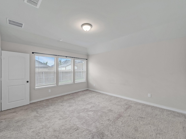 unfurnished room with visible vents, carpet flooring, and baseboards