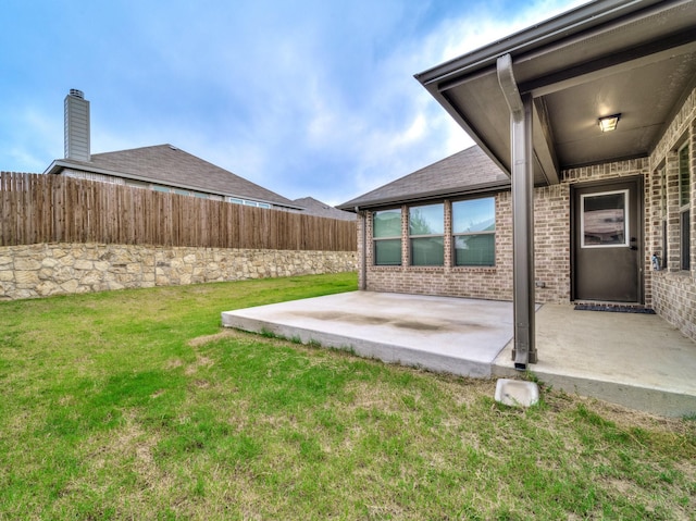 view of yard with a patio area and fence