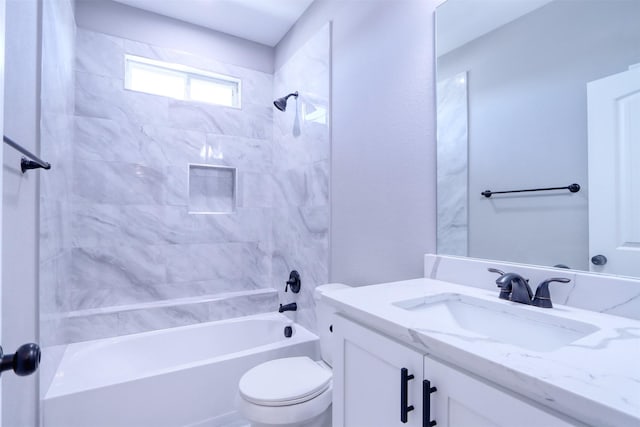 bathroom with vanity, toilet, and shower / tub combination