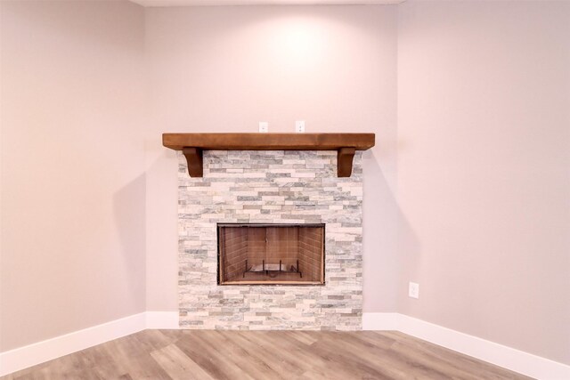 kitchen featuring white cabinets, tasteful backsplash, light wood finished floors, and stainless steel appliances