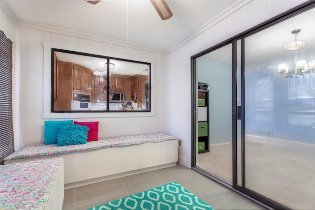 bedroom featuring a closet, a ceiling fan, and crown molding