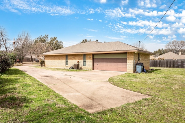 view of front of property featuring a front yard, cooling unit, fence, driveway, and brick siding