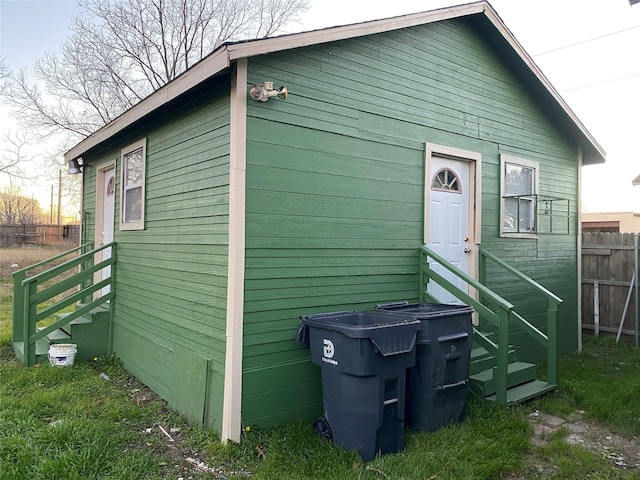 view of outdoor structure featuring fence