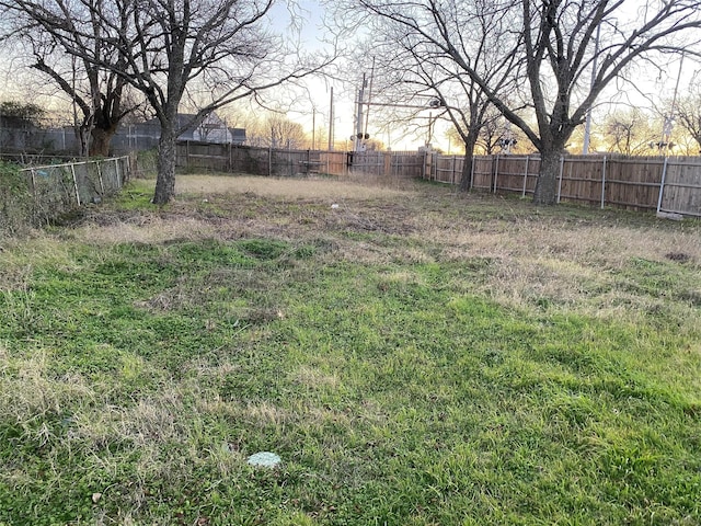 view of yard with a fenced backyard