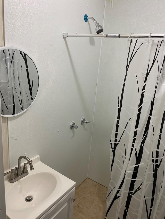 full bathroom featuring vanity, tile patterned floors, and a shower with curtain