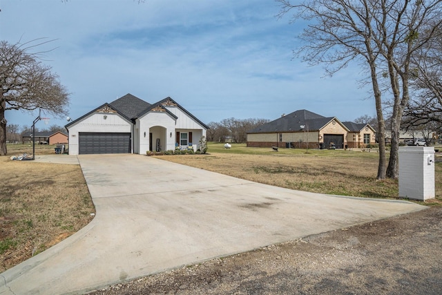 view of front of property featuring a front lawn, an attached garage, board and batten siding, and driveway