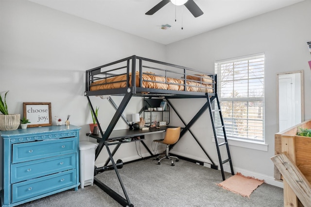 bedroom featuring baseboards, multiple windows, a ceiling fan, and carpet flooring