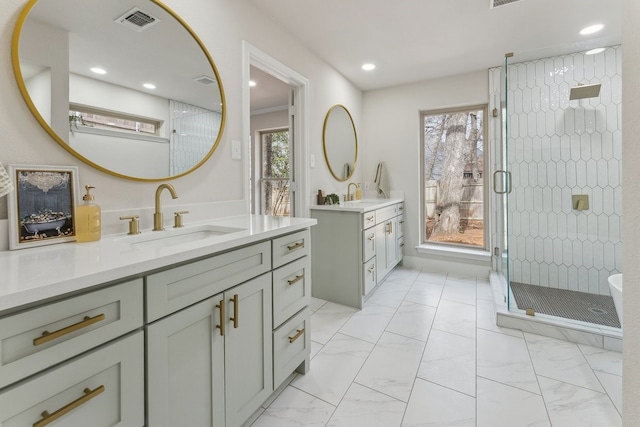 bathroom with visible vents, marble finish floor, and a sink