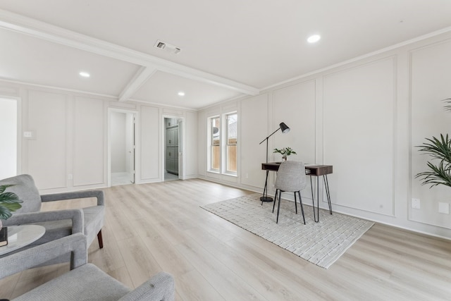 office space with light wood finished floors, visible vents, beam ceiling, recessed lighting, and a decorative wall