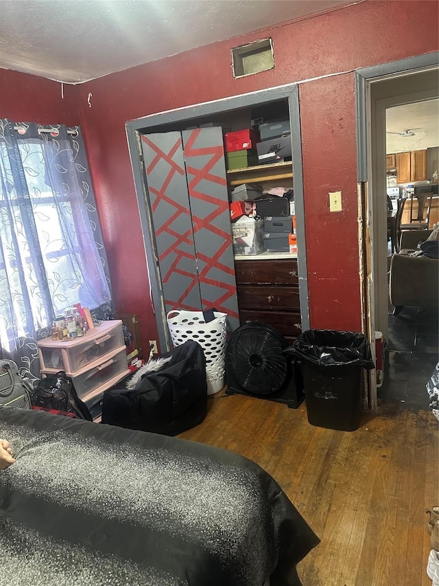 bedroom with hardwood / wood-style flooring