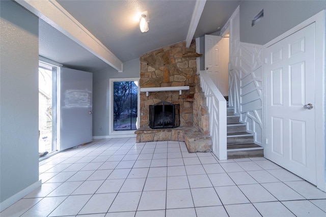 unfurnished living room featuring stairs, a fireplace, light tile patterned floors, baseboards, and vaulted ceiling with beams