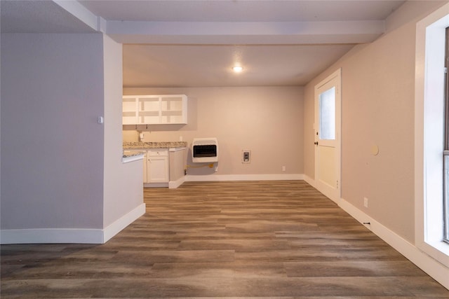 interior space with heating unit, baseboards, dark wood finished floors, recessed lighting, and beamed ceiling