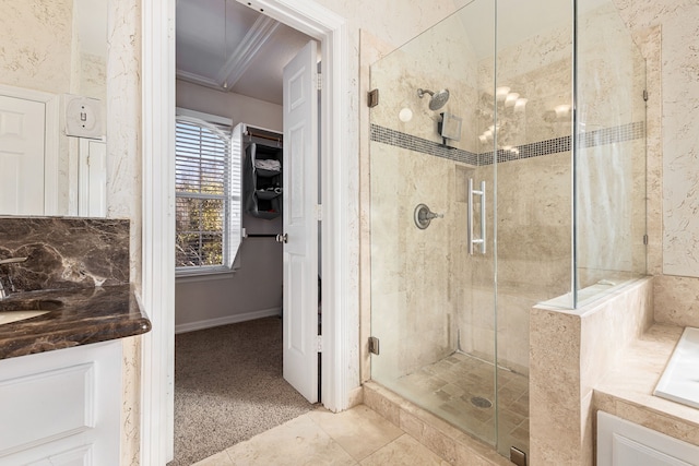 bathroom featuring crown molding, a garden tub, and a stall shower