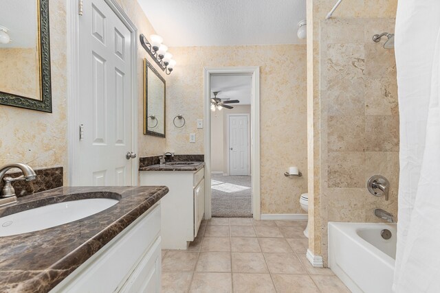 full bathroom with tile patterned flooring, wallpapered walls, two vanities, and a sink