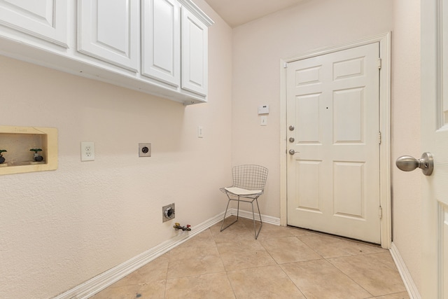 laundry area featuring gas dryer hookup, hookup for an electric dryer, hookup for a washing machine, and light tile patterned floors