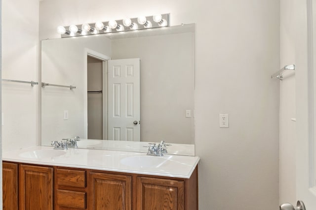 full bathroom featuring a sink and double vanity