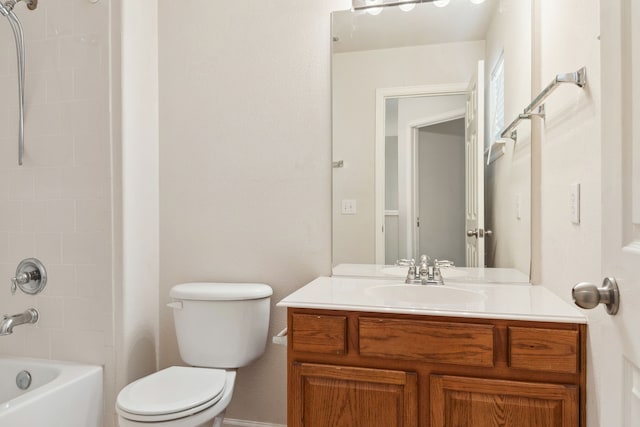 bathroom featuring toilet, vanity, and washtub / shower combination