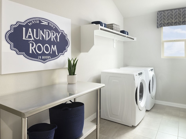 laundry area with washer and clothes dryer, laundry area, and baseboards