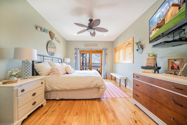 bedroom featuring baseboards, light wood-type flooring, ceiling fan, and access to outside