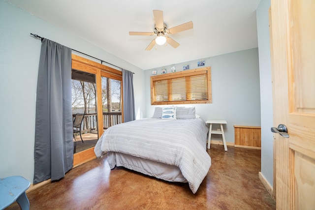 bedroom featuring ceiling fan, concrete floors, baseboards, and access to outside