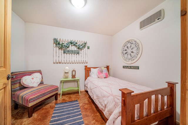 carpeted bedroom featuring visible vents