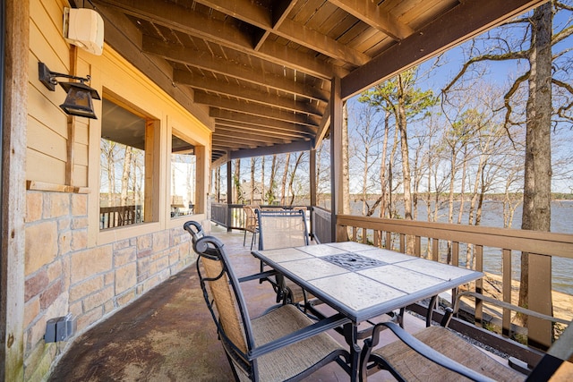 view of patio / terrace featuring outdoor dining area and a water view