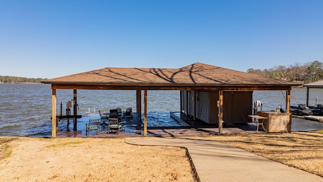 dock area featuring a water view and boat lift