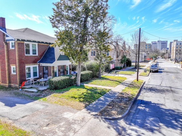 exterior space featuring curbs and sidewalks