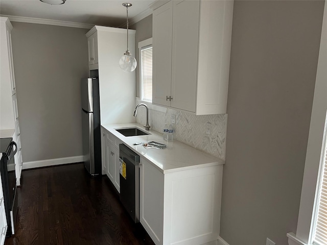 kitchen featuring dark wood-style floors, ornamental molding, stainless steel appliances, and a sink